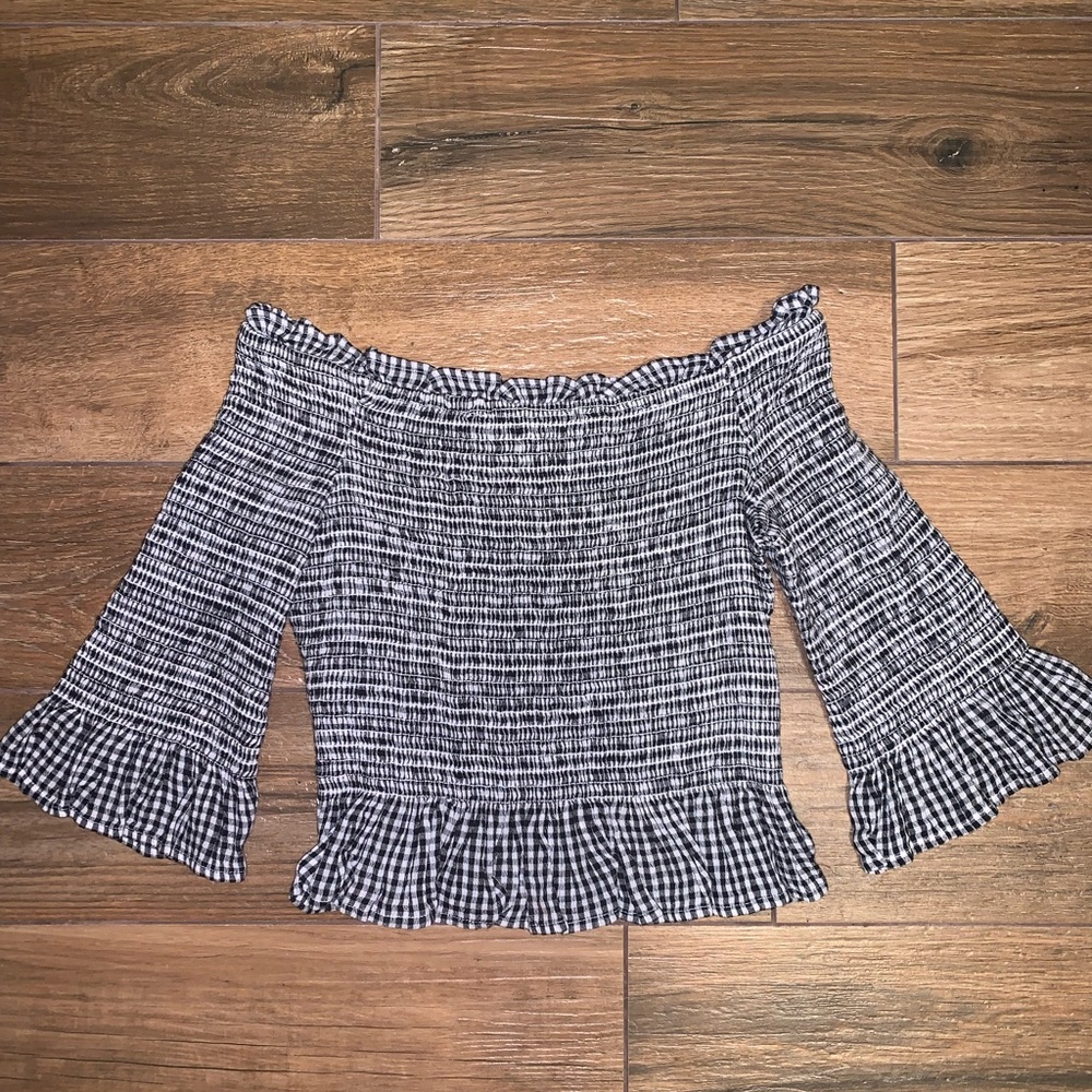 Fitted off the shoulder top with ruffle hem